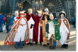Boys dressed as the three kings outside a German Cathedral